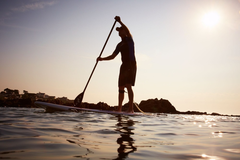 Stand up paddleboarding at Cobo Bay Guernsey